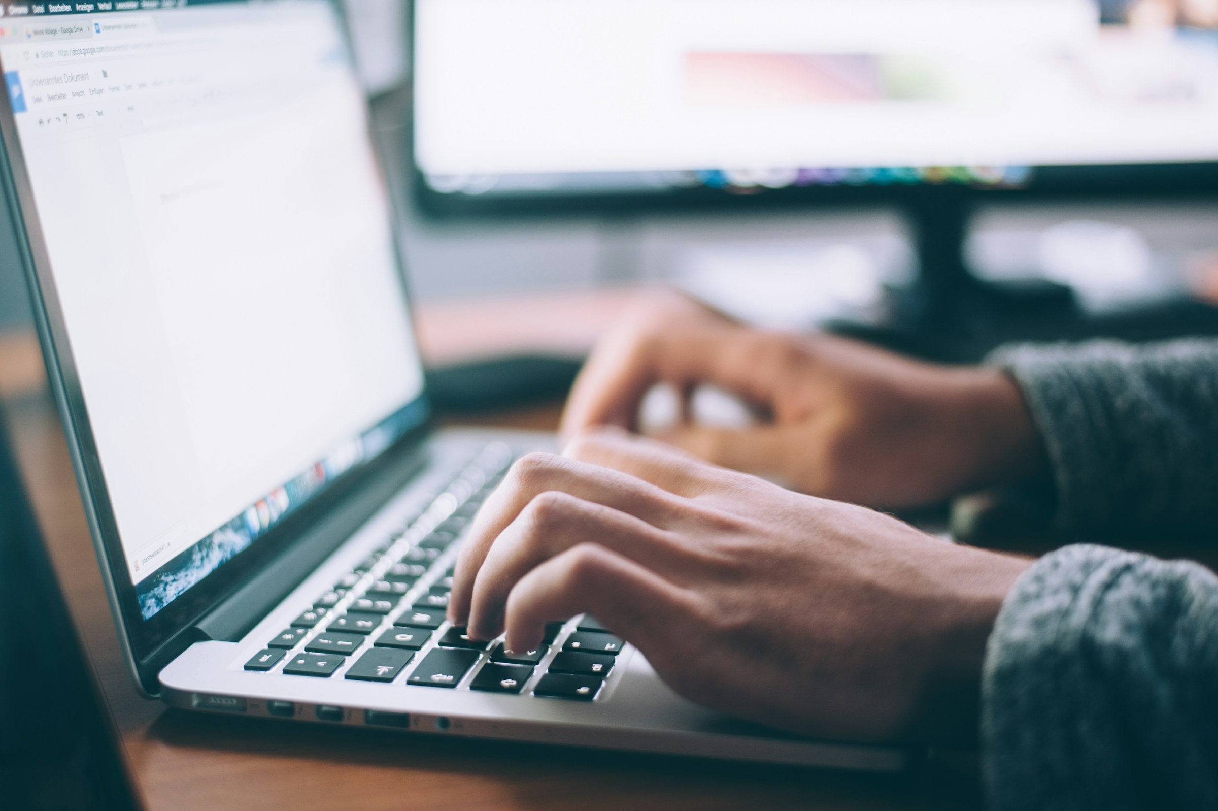 A researcher working on a laptop