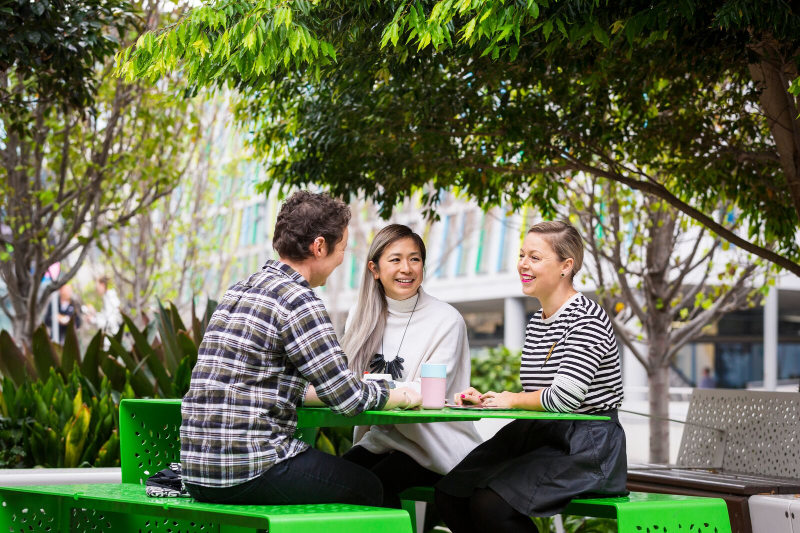 Research staff seated outside at table