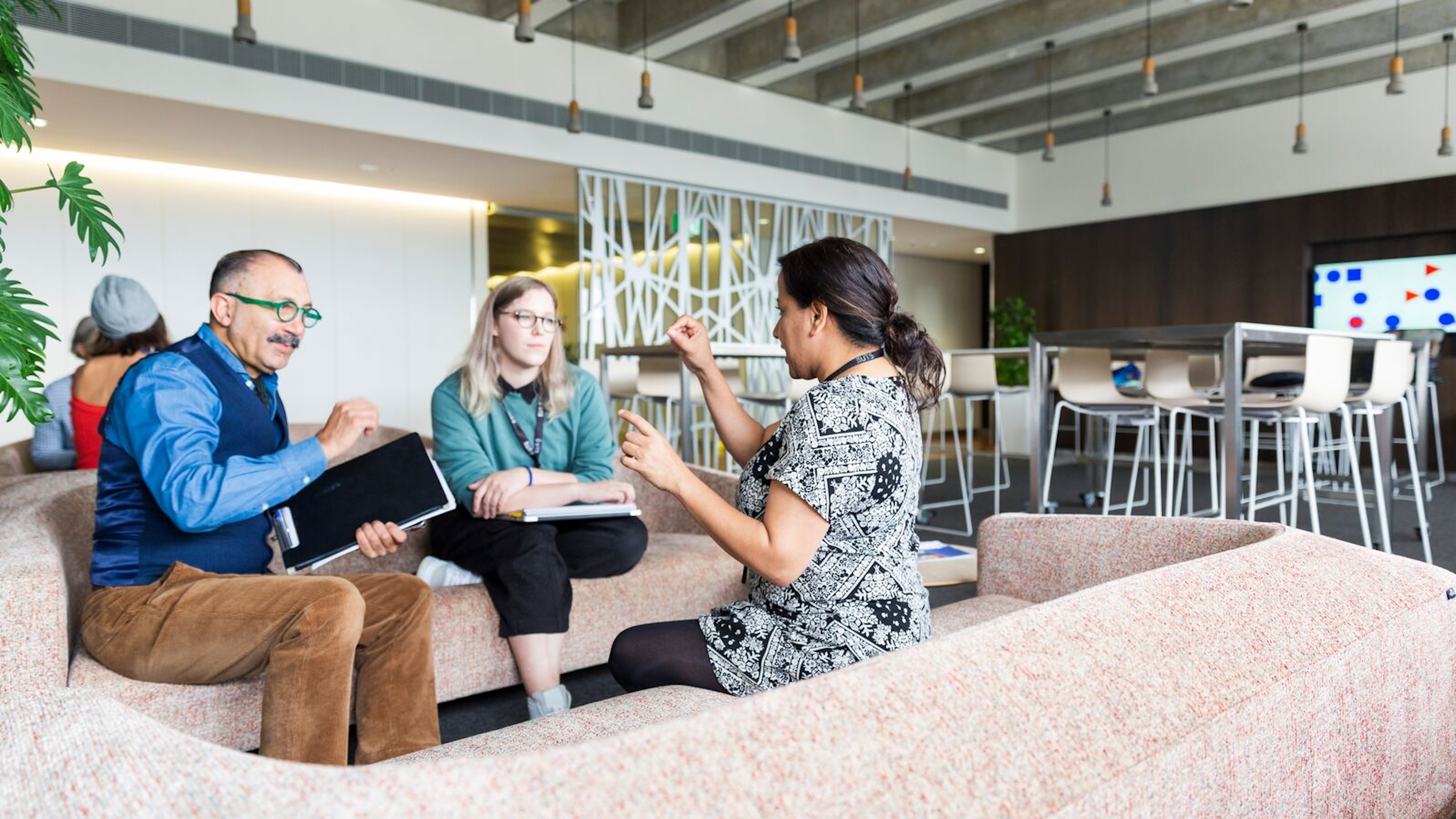 Three researchers in discussion