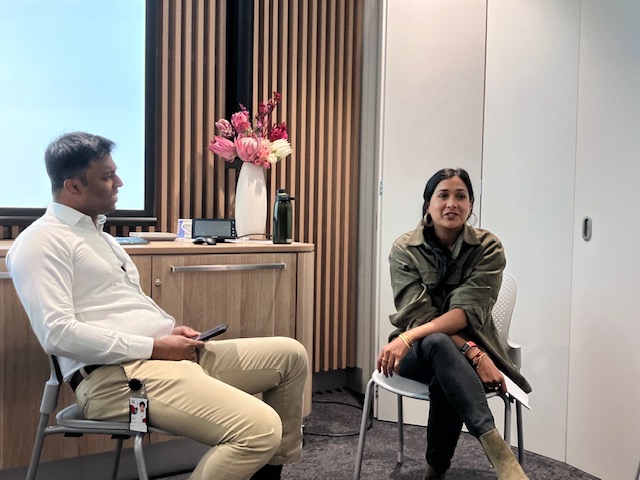 man and woman sitting and  talking