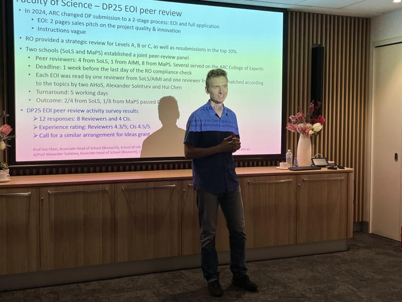 Alex Solntsev speaking at Research Cafe